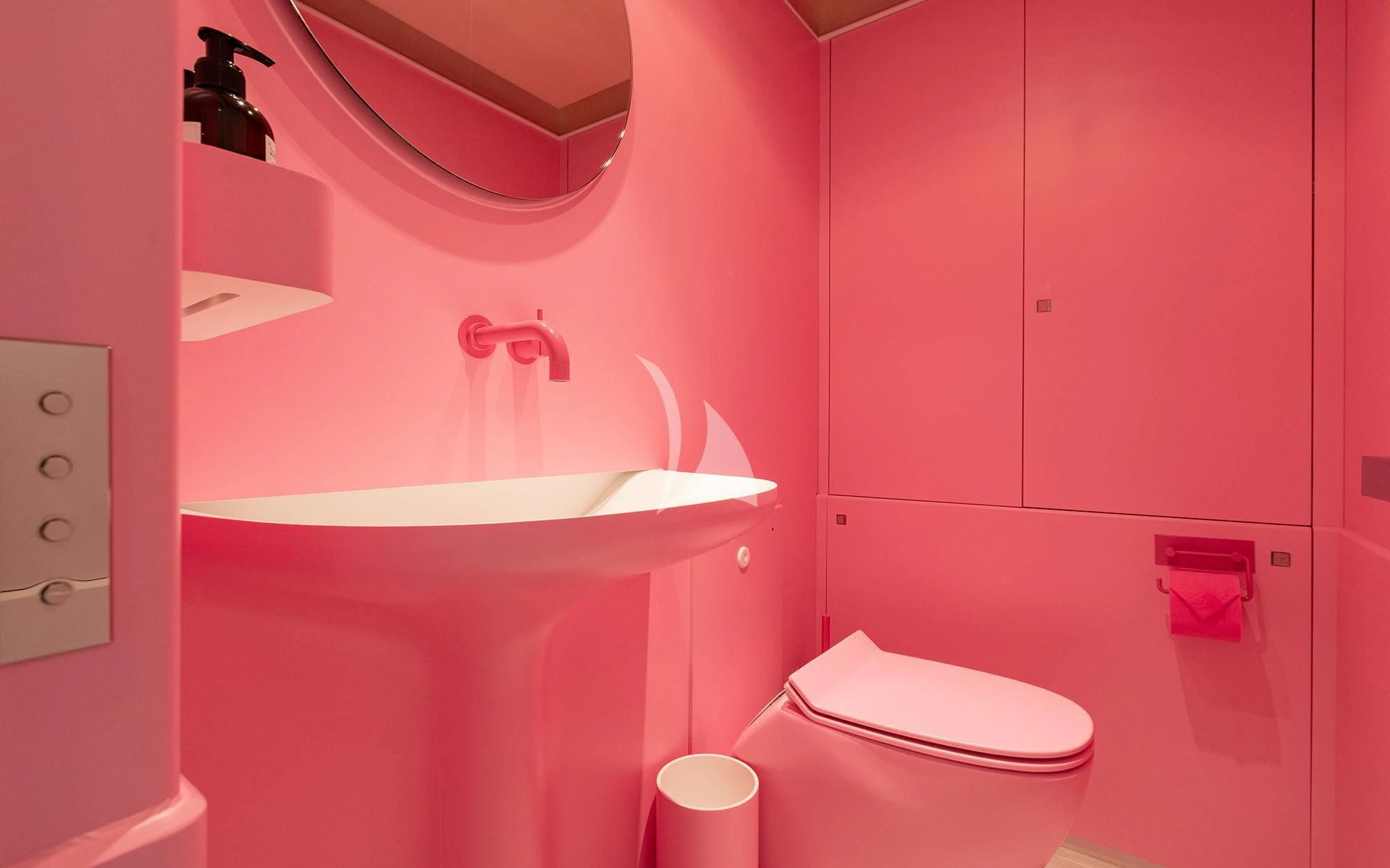 a pink bathroom with a sink and toilet aboard SERENDIPITY I Yacht for Charter