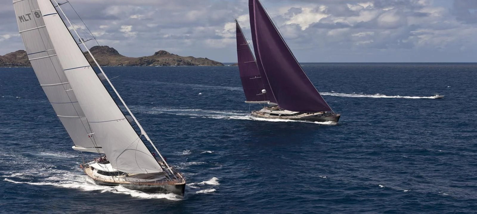 a couple of sailboats in the water aboard SERENDIPITY I Yacht for Charter