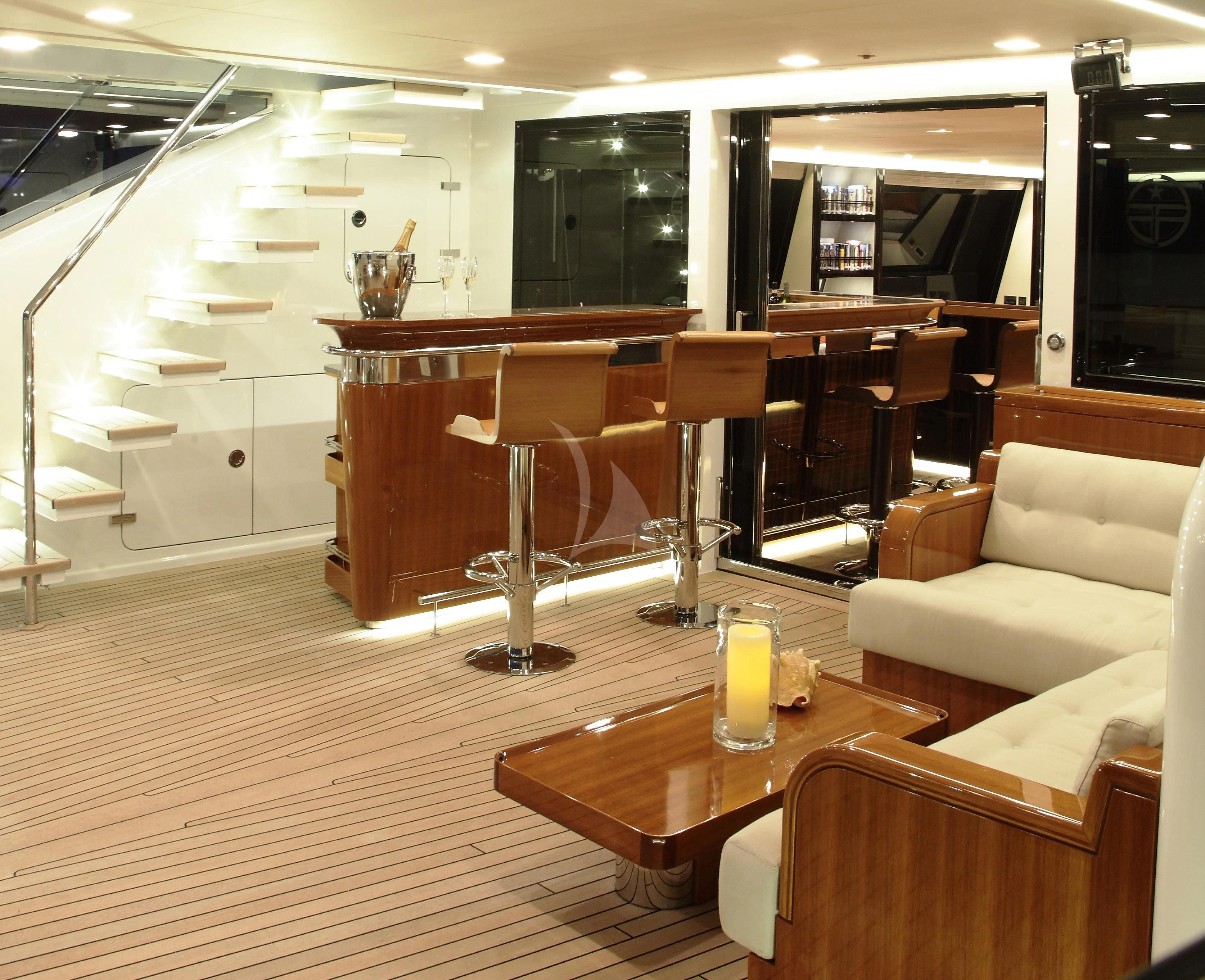 a room with a table and chairs aboard SERENDIPITY I Yacht for Charter