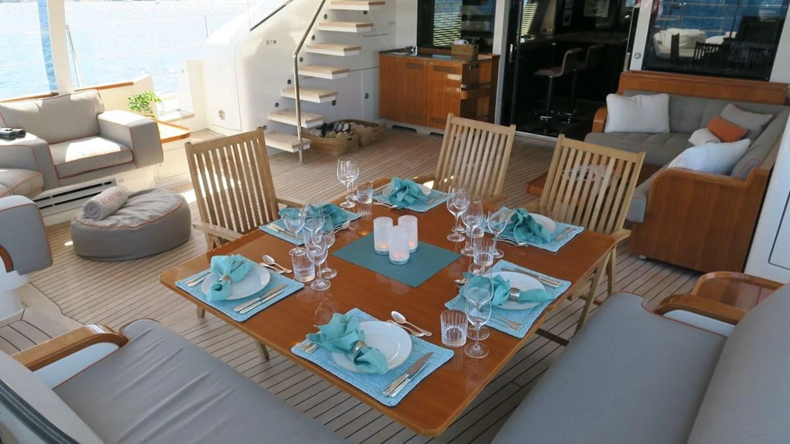 a living room with a table and chairs aboard SERENDIPITY I Yacht for Charter