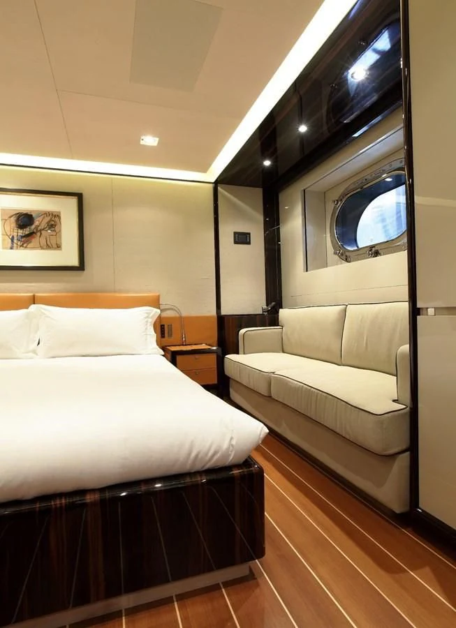 a bed and a couch in a room aboard SERENDIPITY I Yacht for Charter