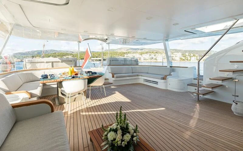 a boat with a table and chairs aboard SERENDIPITY I Yacht for Charter