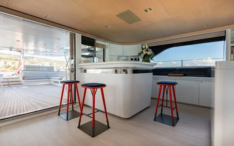 a kitchen with stools and stools aboard SERENDIPITY I Yacht for Charter