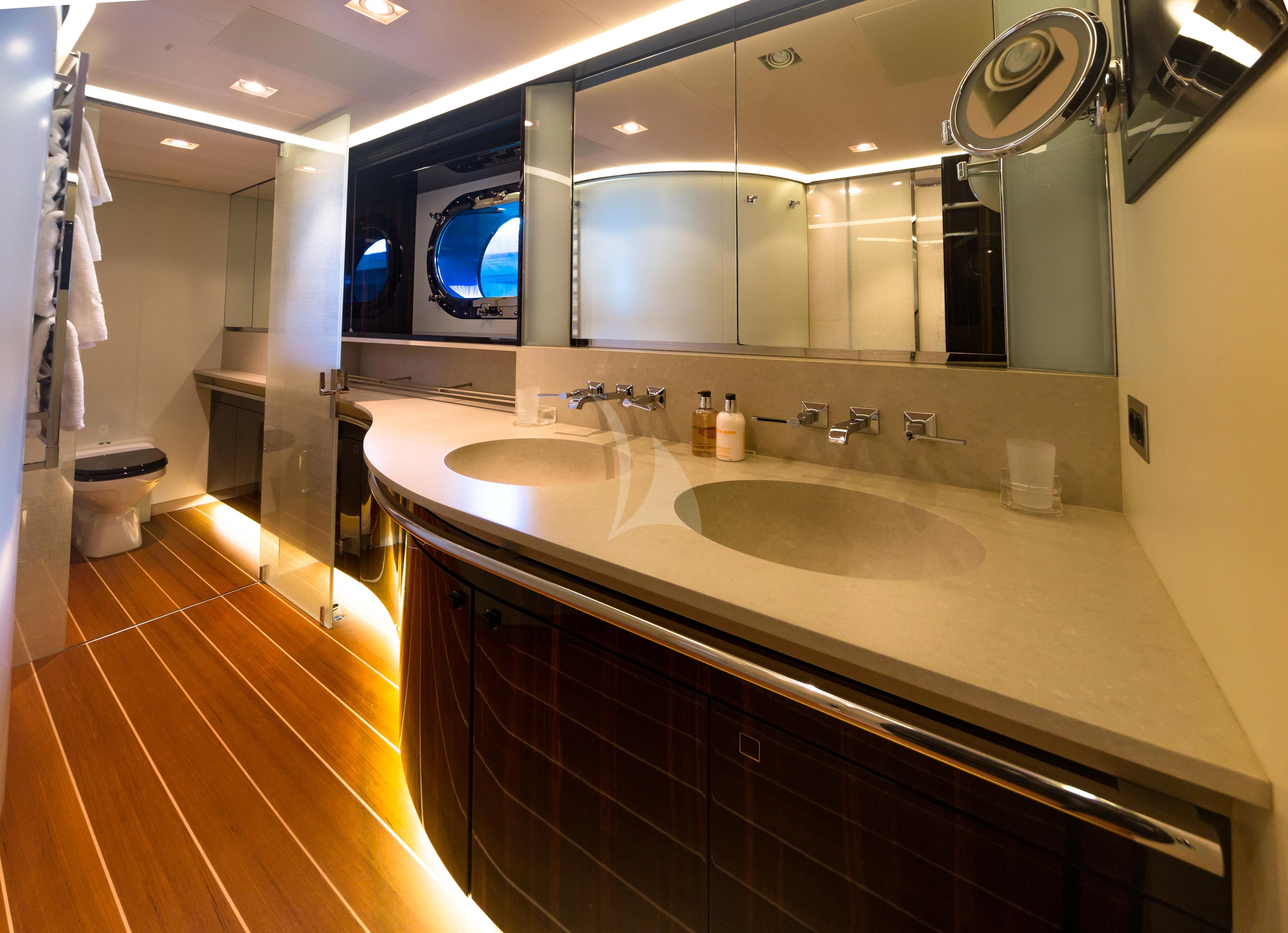 a bathroom with a large mirror aboard SERENDIPITY I Yacht for Charter