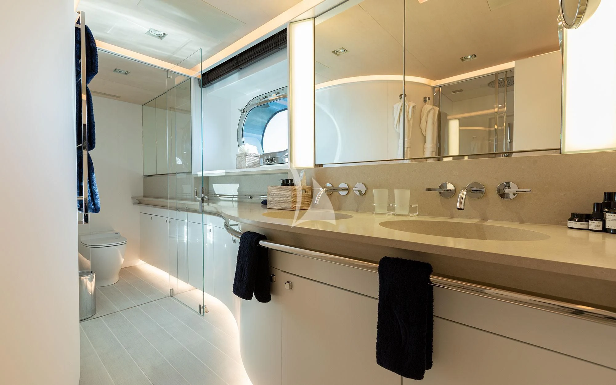 a bathroom with a large mirror aboard SERENDIPITY I Yacht for Charter