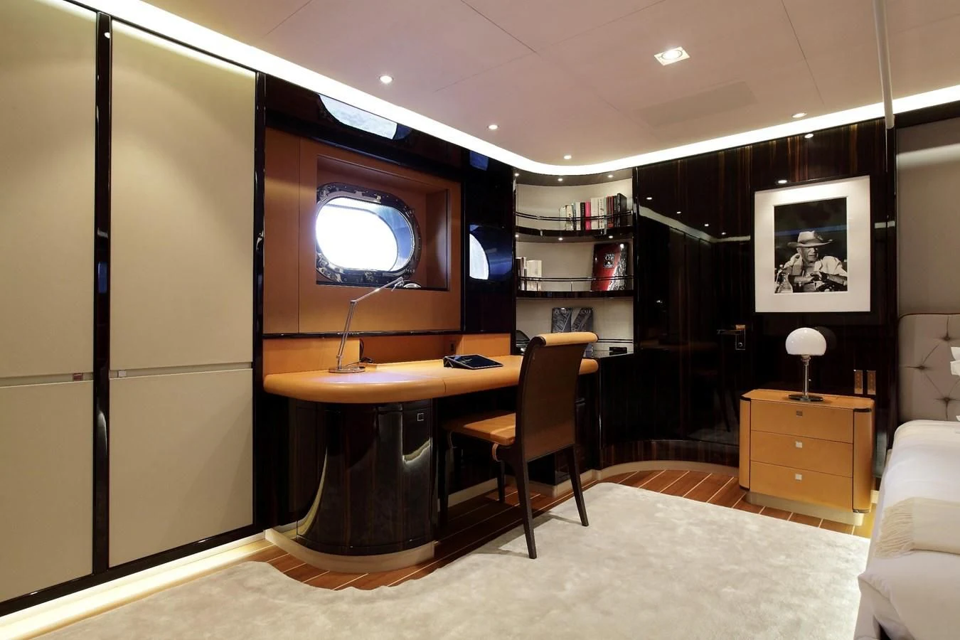 a room with a tv and a desk aboard SERENDIPITY I Yacht for Charter