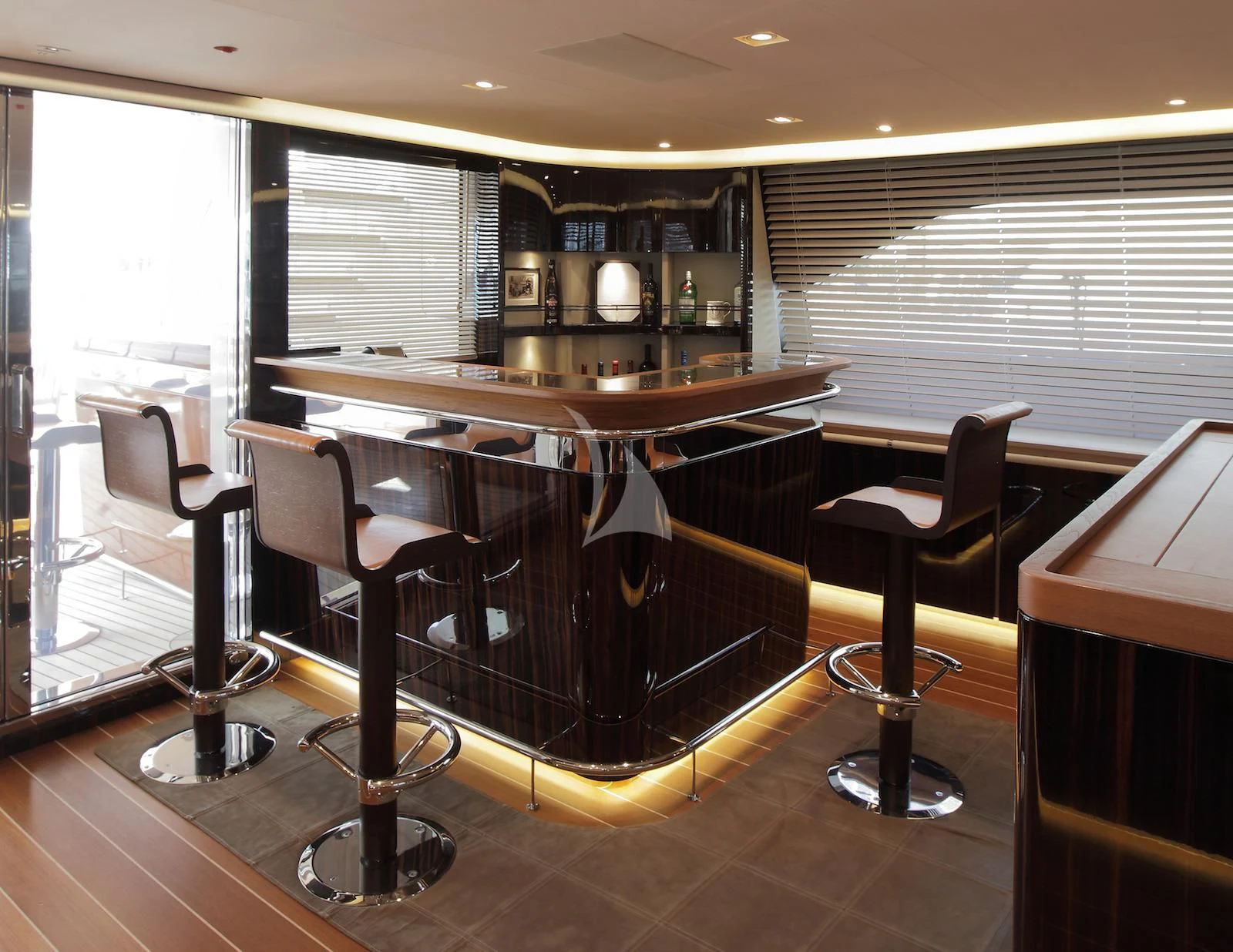 a bar with a bar and chairs aboard SERENDIPITY I Yacht for Charter