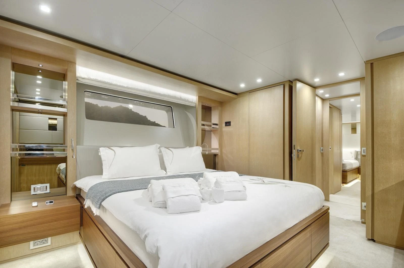 a bedroom with a bed and a closet aboard THERAPY Yacht for Sale