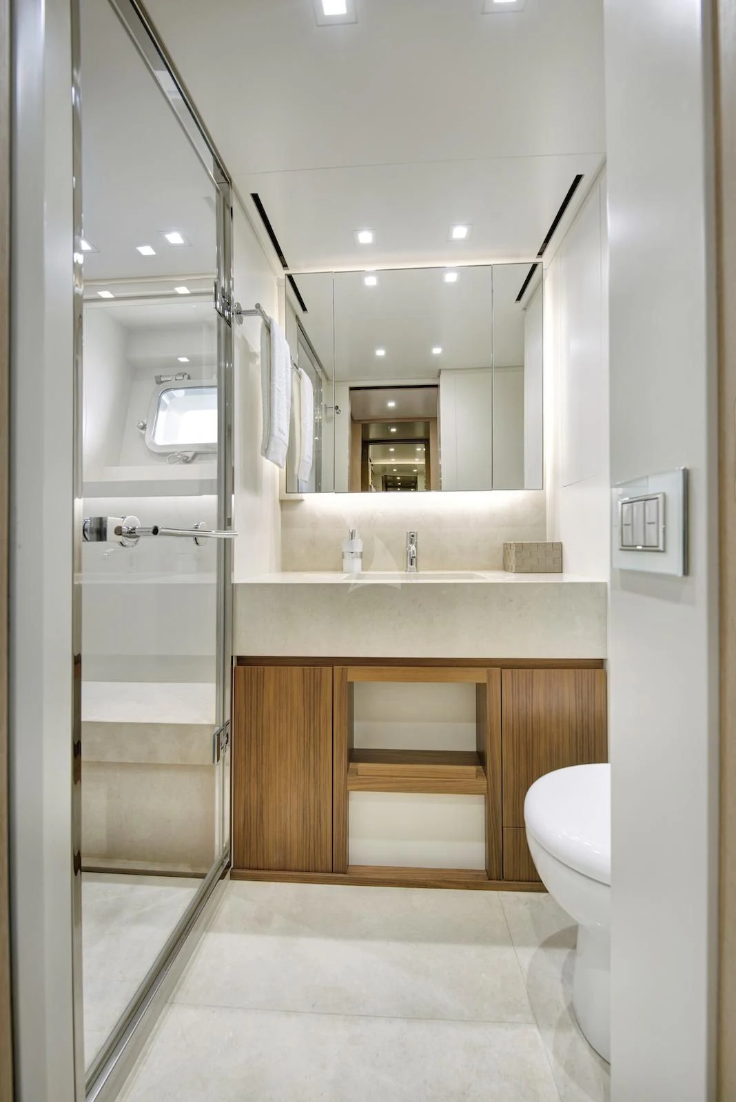 a bathroom with a glass shower aboard THERAPY Yacht for Sale