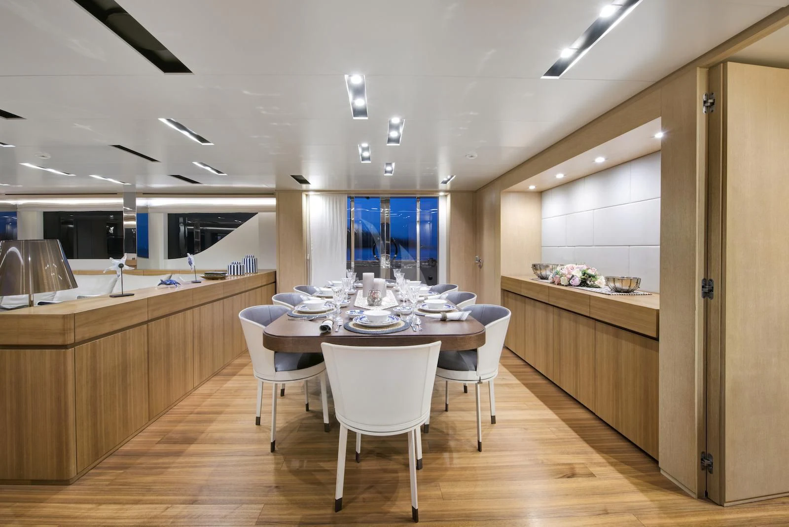 a large kitchen with a table and chairs aboard THERAPY Yacht for Sale