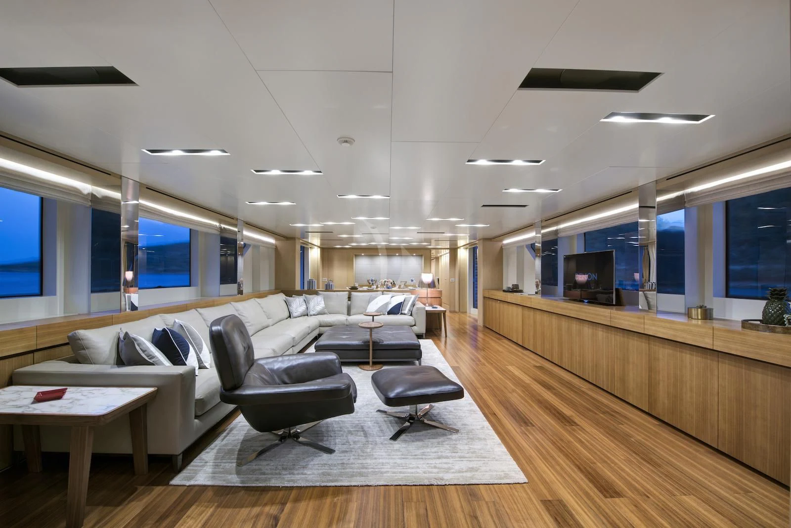 a modern looking living room aboard THERAPY Yacht for Sale