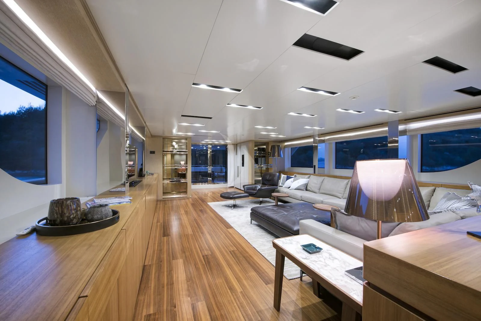 a room with a wood floor and a large window aboard THERAPY Yacht for Sale