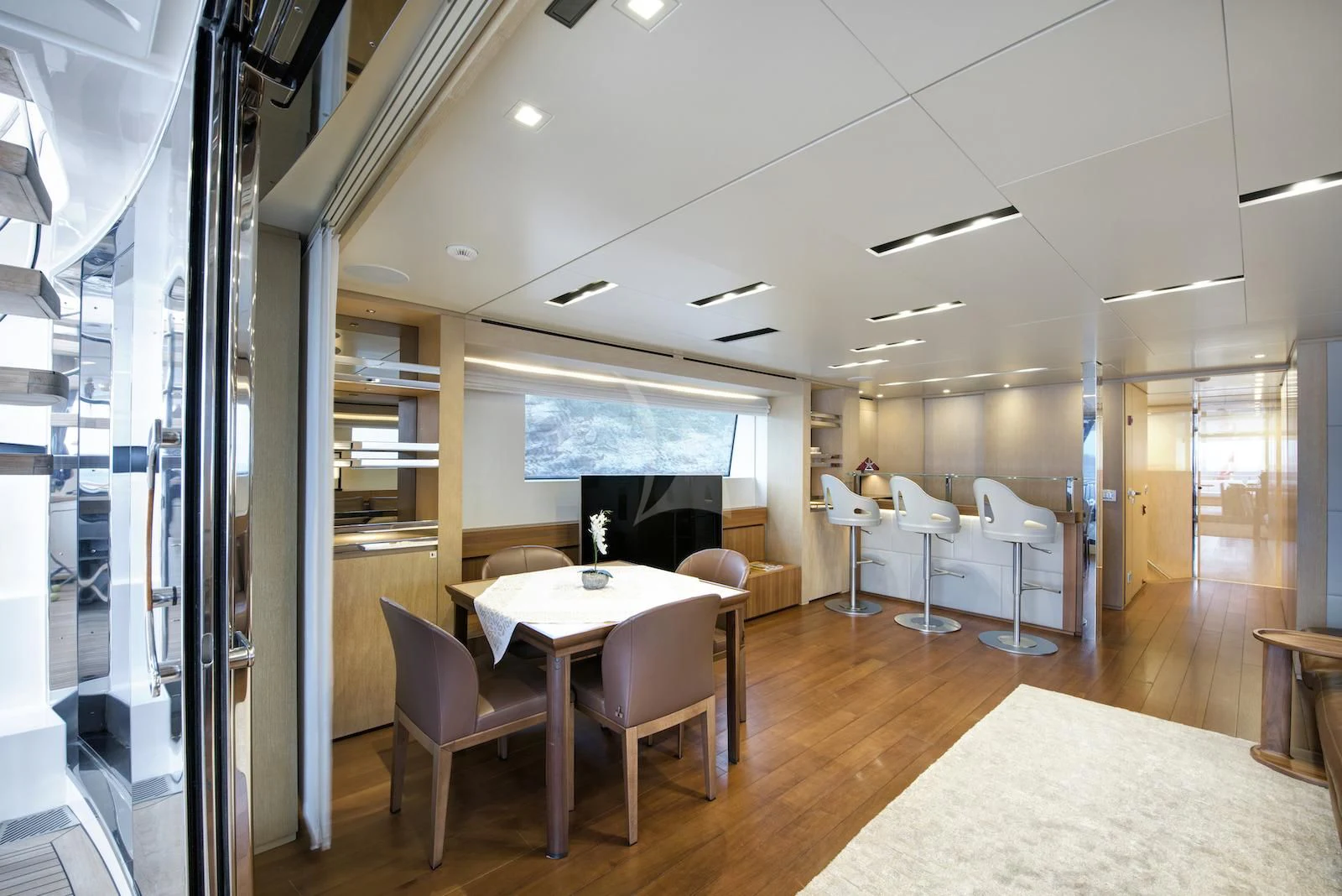 a room with tables and chairs aboard THERAPY Yacht for Sale