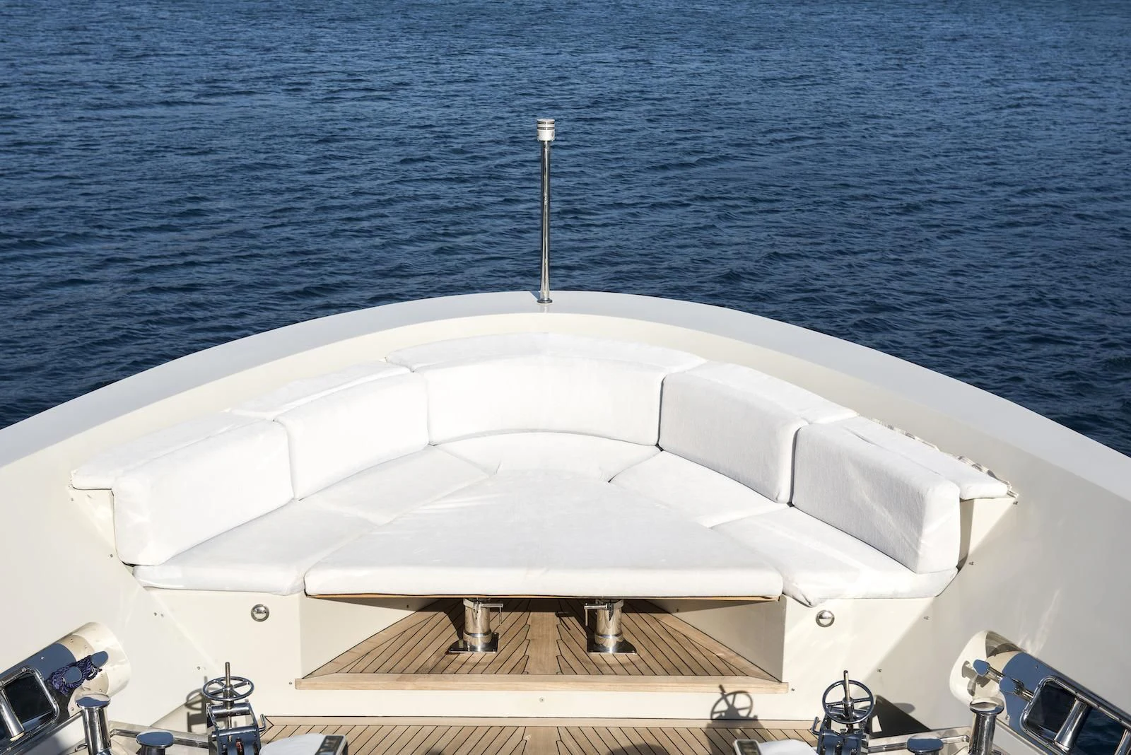 a white bathtub with a faucet and a metal faucet on the side of aboard THERAPY Yacht for Sale
