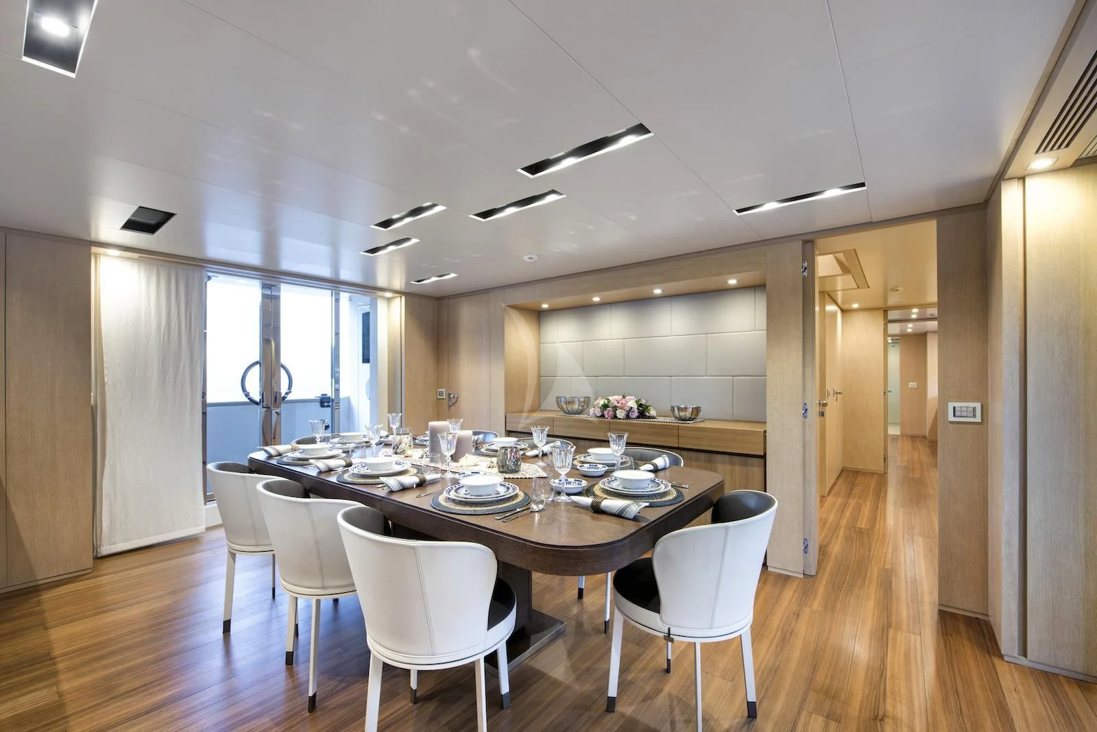 a large kitchen with a dining table aboard THERAPY Yacht for Sale