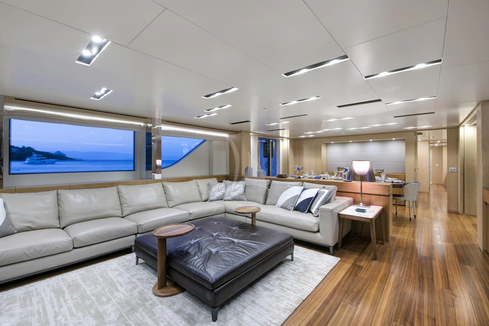a living room with a large screen aboard THERAPY Yacht for Sale