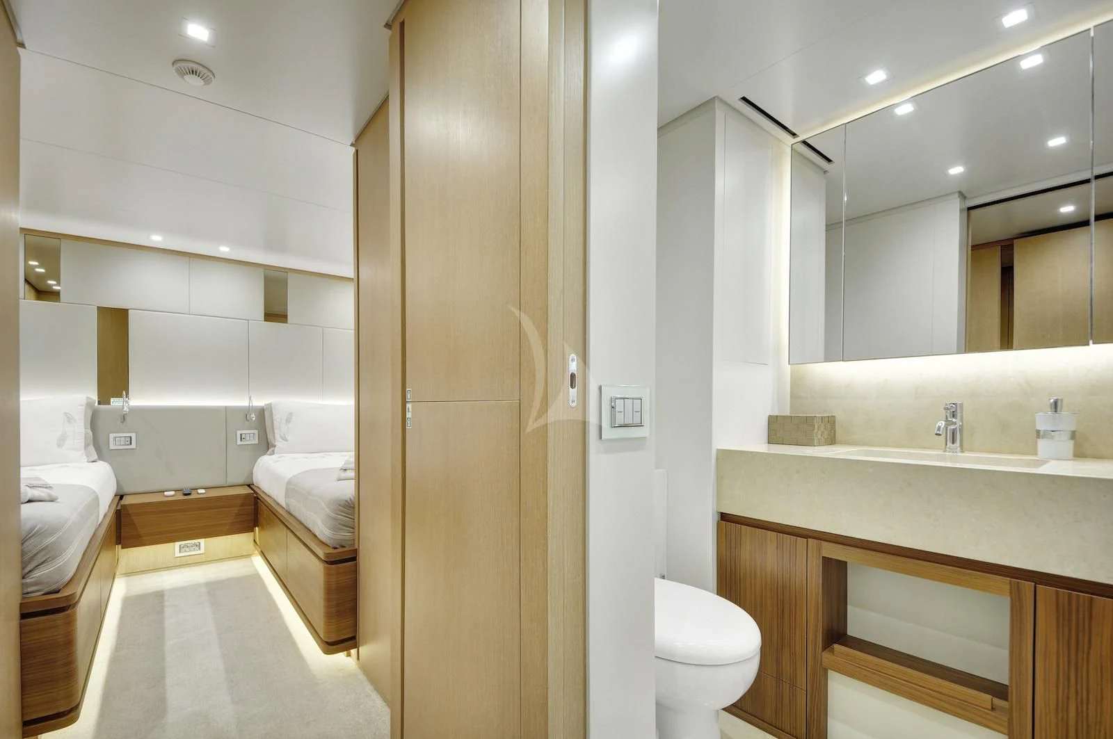 a bathroom with a large mirror aboard THERAPY Yacht for Sale