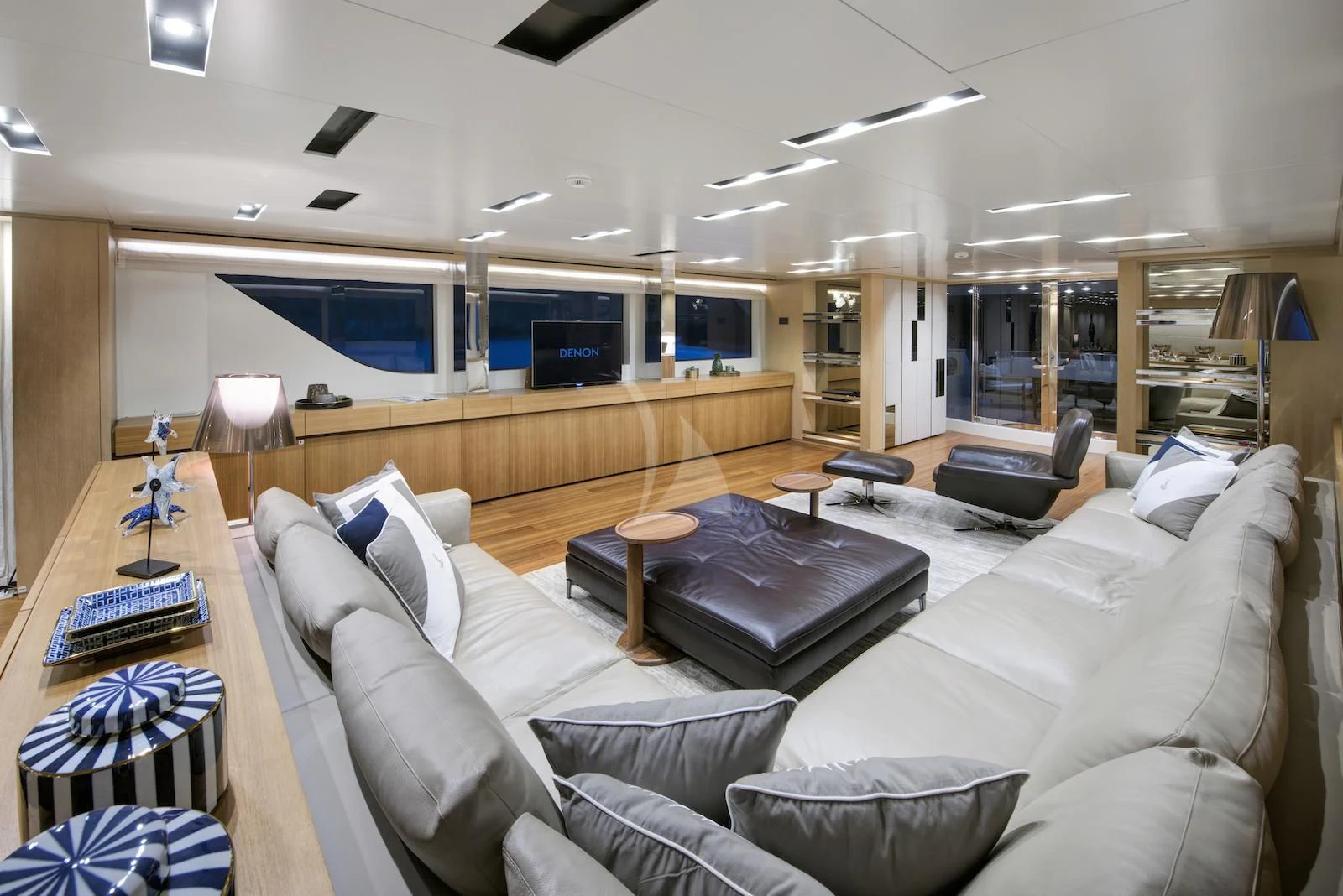 a living room with a large couch aboard THERAPY Yacht for Sale