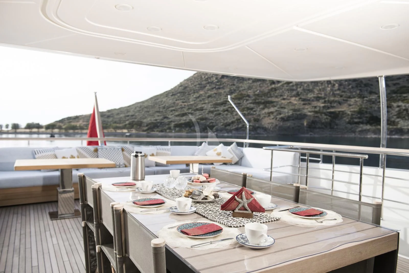 a table with plates and plates on it aboard THERAPY Yacht for Sale