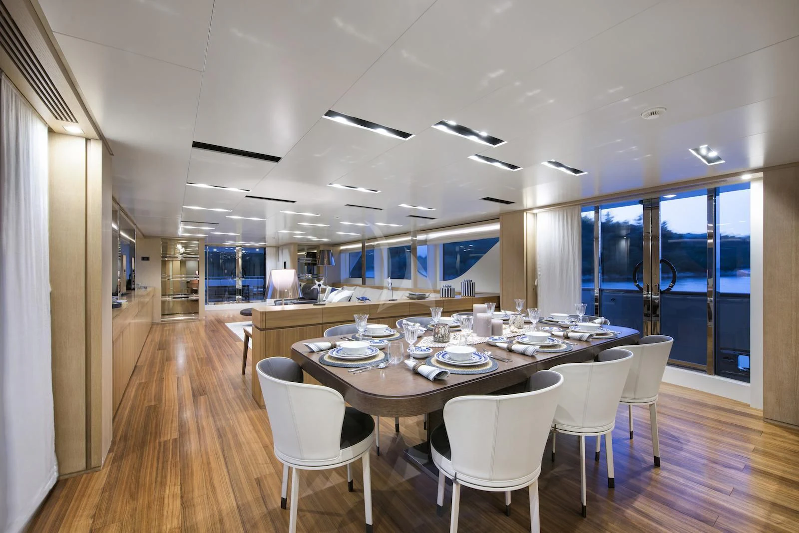 a long table with chairs around it aboard THERAPY Yacht for Sale