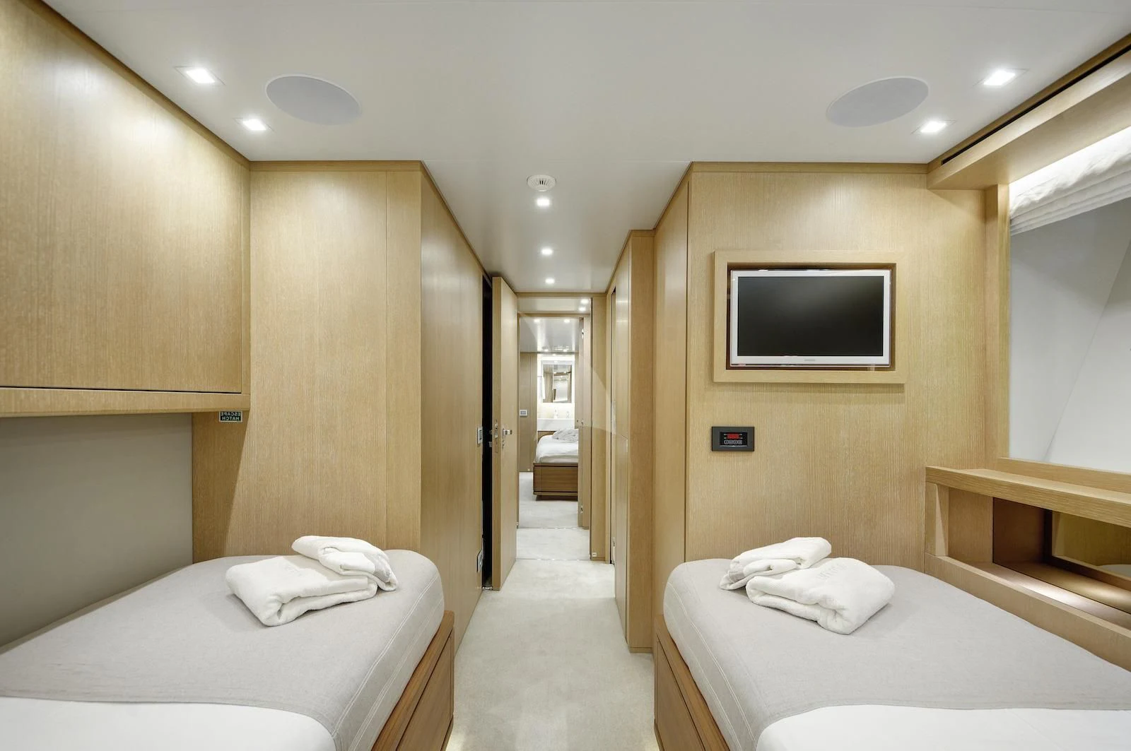 a room with a bed and a television aboard THERAPY Yacht for Sale