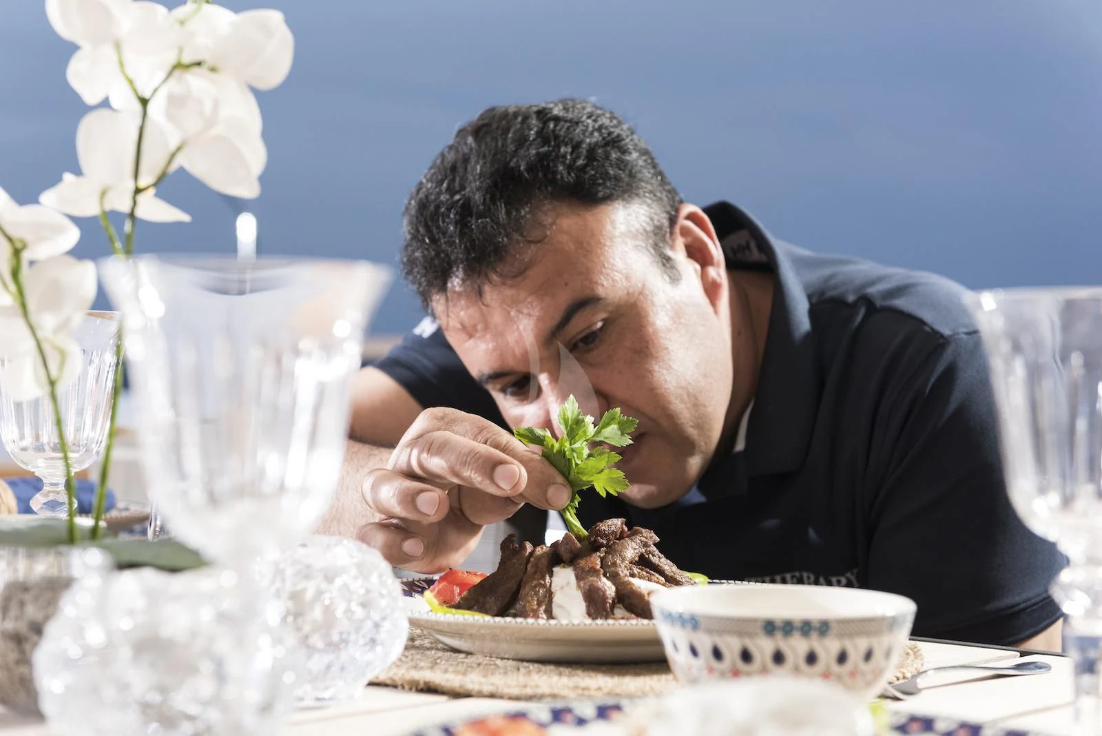 a man eating food aboard THERAPY Yacht for Sale