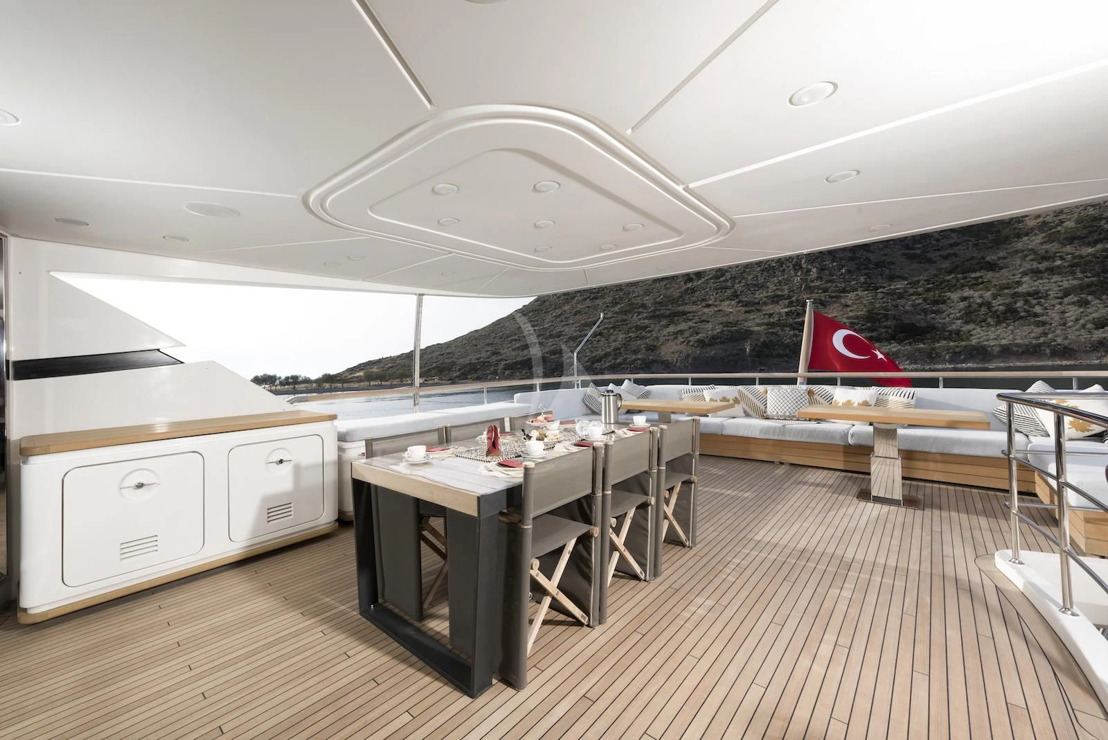 a large room with tables and chairs aboard THERAPY Yacht for Sale