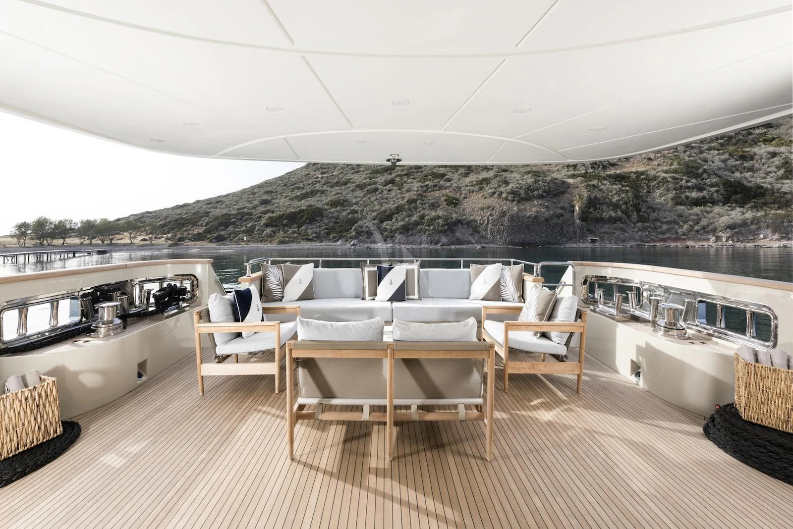 a large patio with a table and chairs on it aboard THERAPY Yacht for Sale