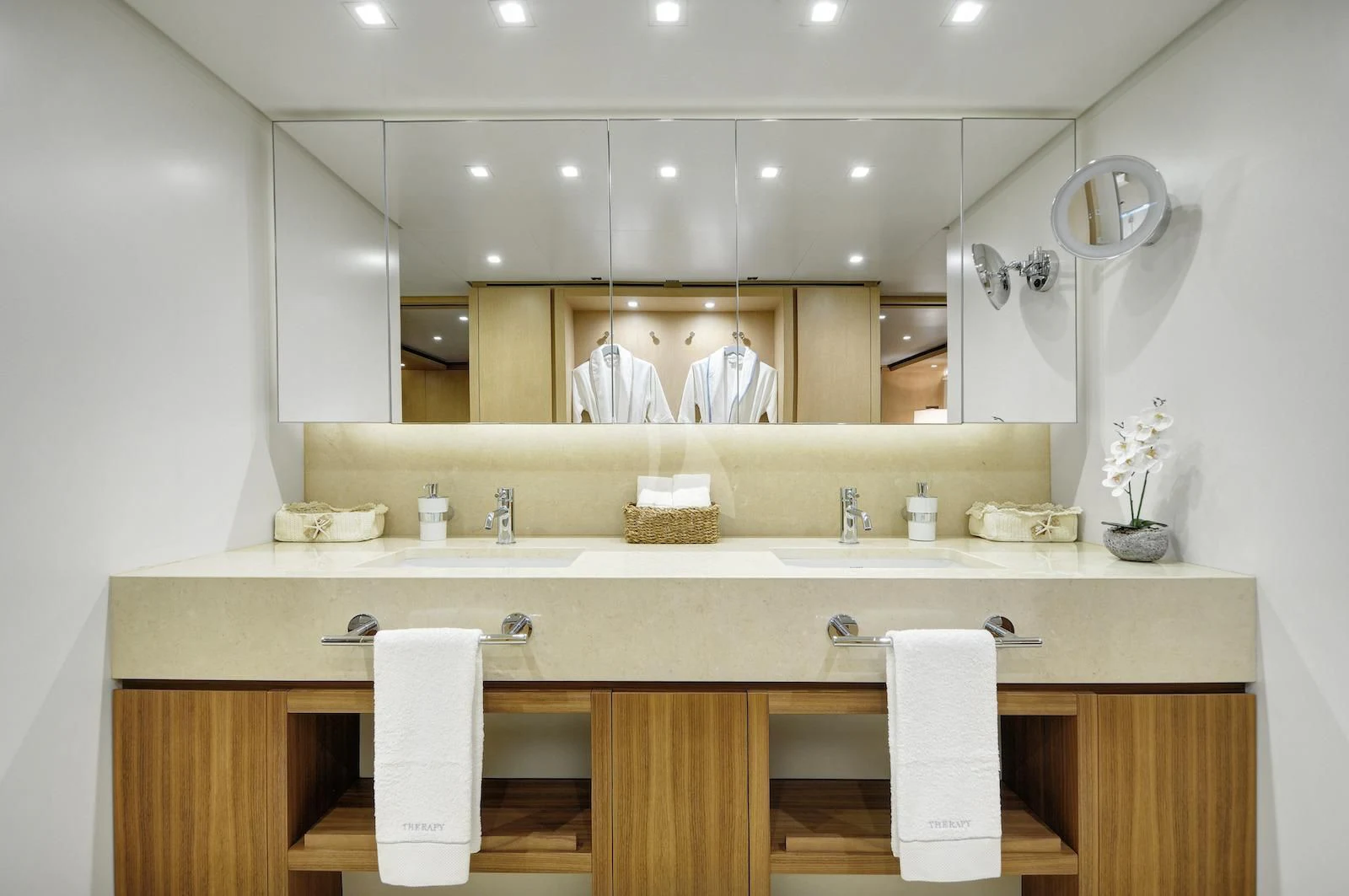 a bathroom with a large mirror aboard THERAPY Yacht for Sale