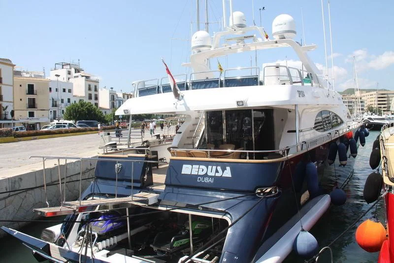 a boat docked at a pier aboard SPECTRE Yacht for Sale