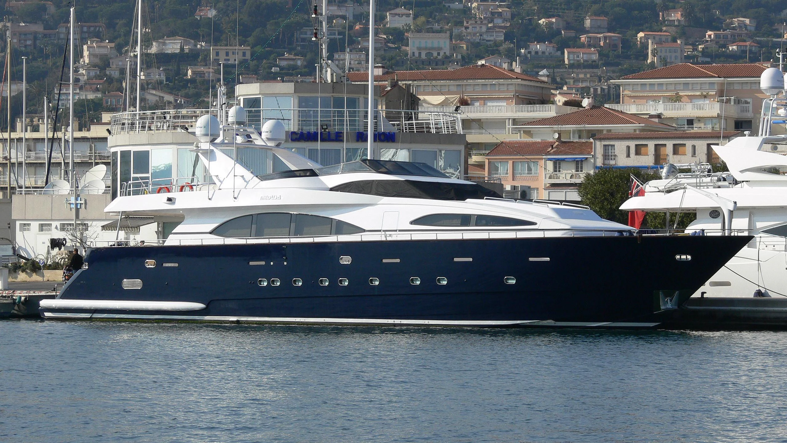 a group of boats in a harbor aboard SPECTRE Yacht for Sale