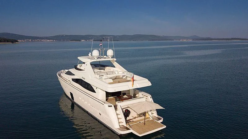 a white boat in the water aboard NEOSTAR Yacht for Sale