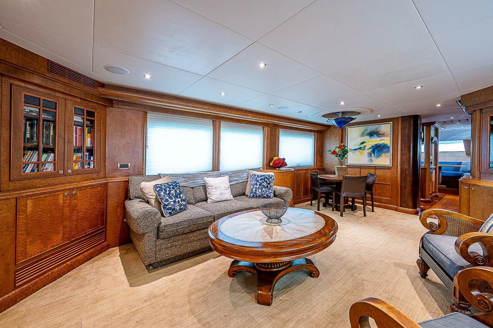 a living room with a couch and a table aboard PREDATOR I Yacht for Sale