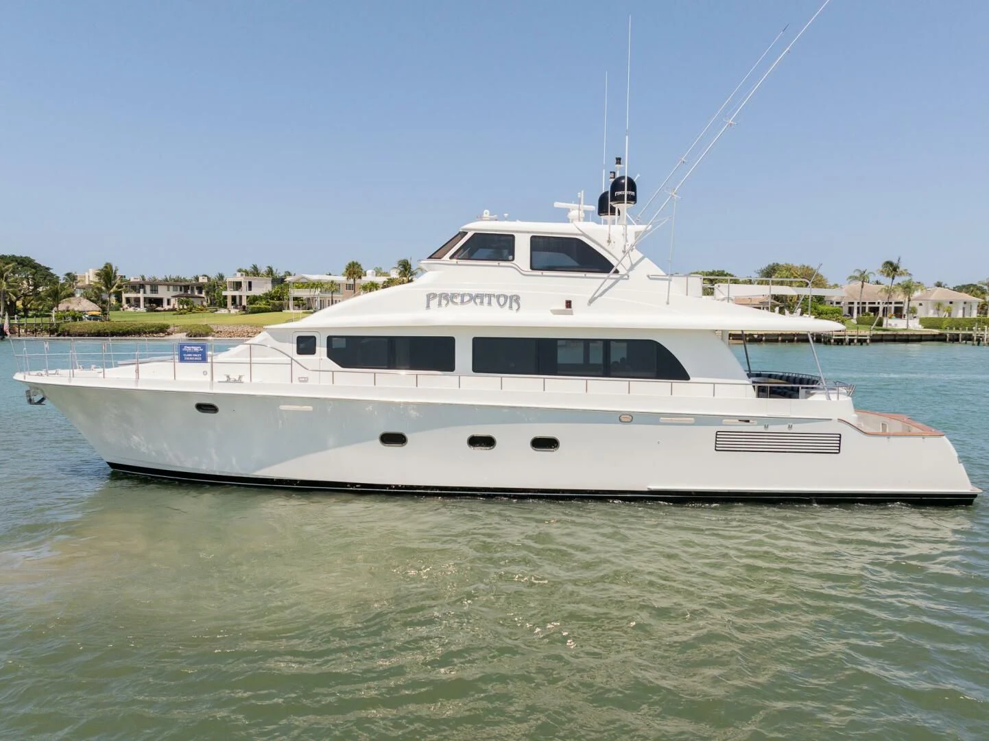 a white boat in the water aboard PREDATOR I Yacht for Sale