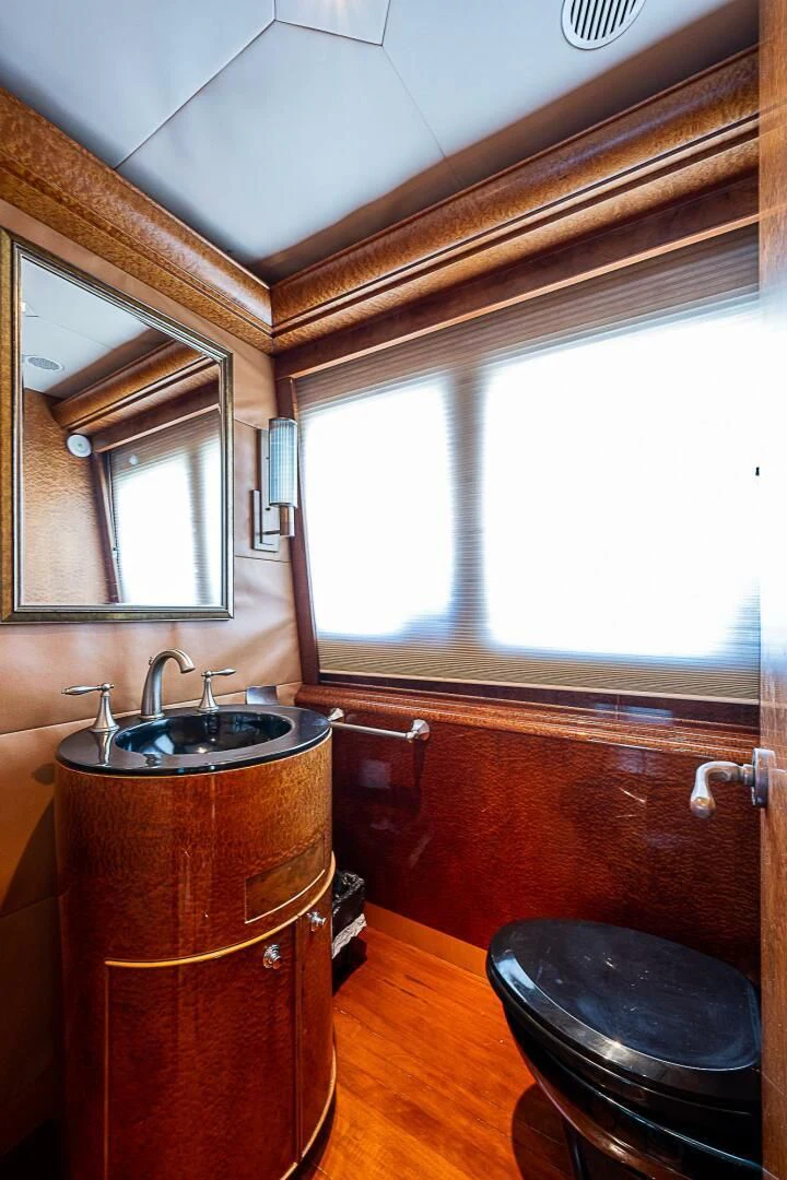 a bathroom with a sink and a mirror aboard PREDATOR I Yacht for Sale