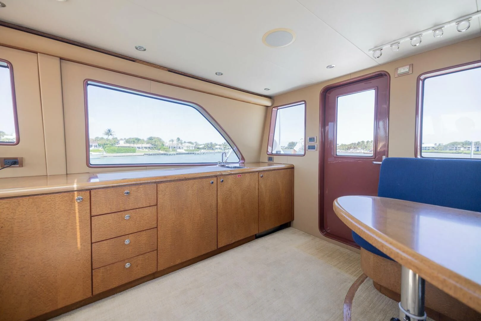 a room with a table and a window aboard PREDATOR I Yacht for Sale