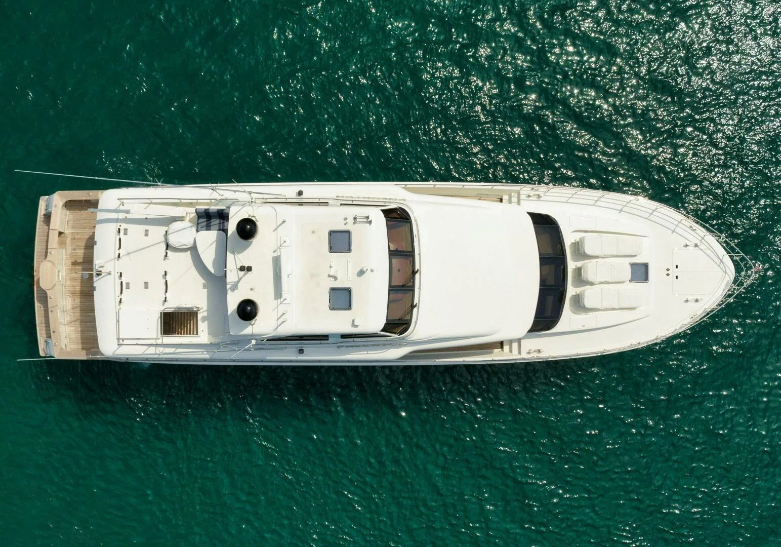 a white ship on a green surface aboard PREDATOR I Yacht for Sale