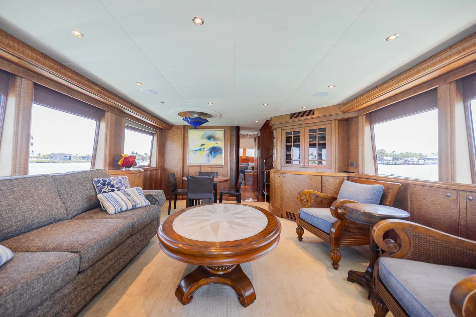 a living room with a couch and a table aboard PREDATOR I Yacht for Sale