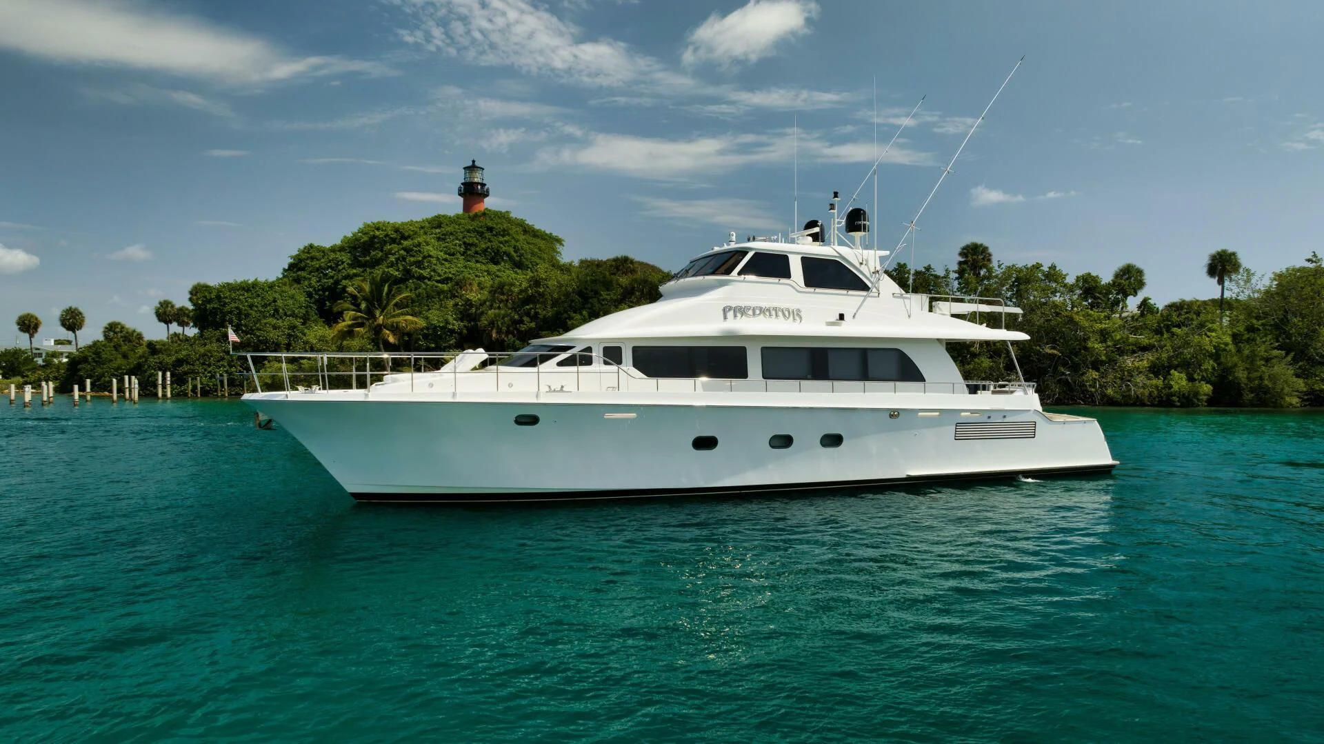 a white boat in the water aboard PREDATOR I Yacht for Sale