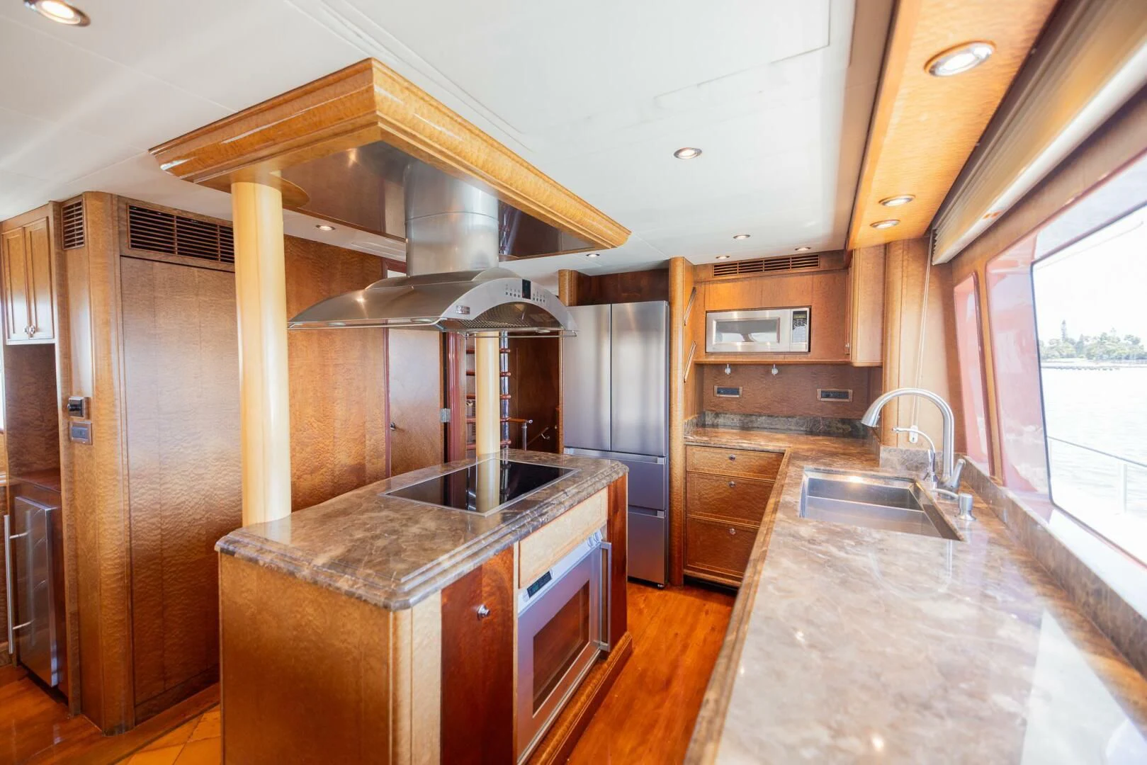 a kitchen with a large island aboard PREDATOR I Yacht for Sale