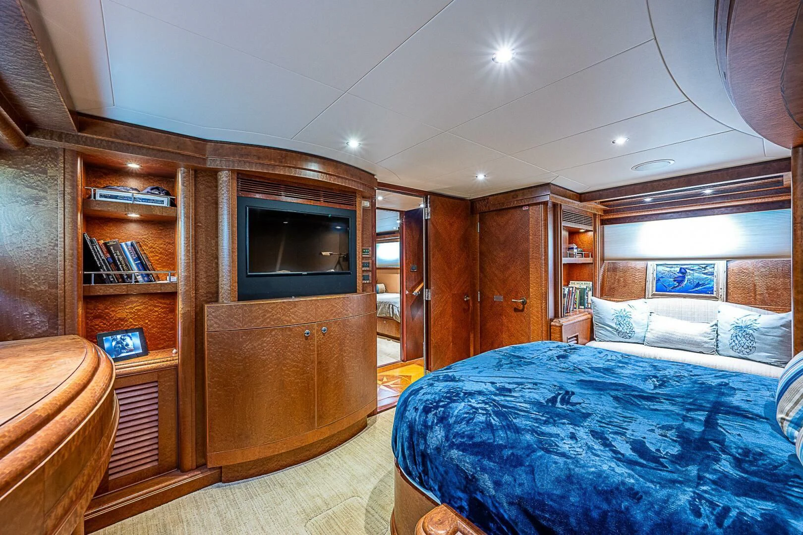a bedroom with a bed and a tv aboard PREDATOR I Yacht for Sale