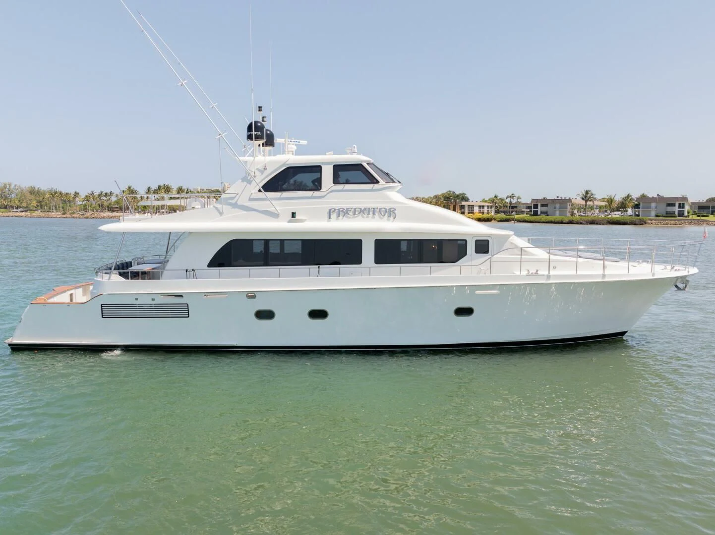 a white boat in the water aboard PREDATOR I Yacht for Sale