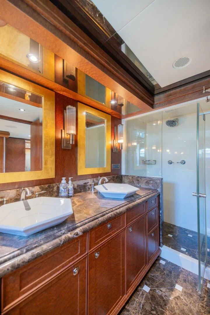 a bathroom with two sinks aboard PREDATOR I Yacht for Sale
