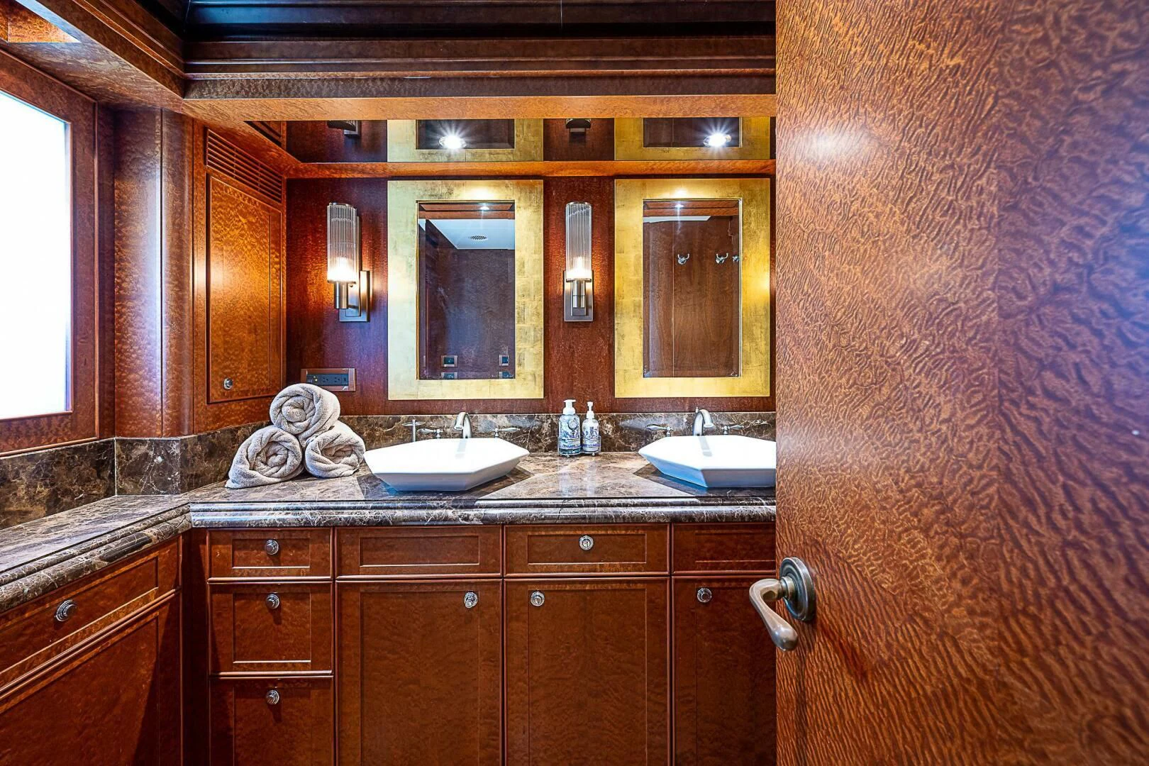 a bathroom with a sink and a mirror aboard PREDATOR I Yacht for Sale