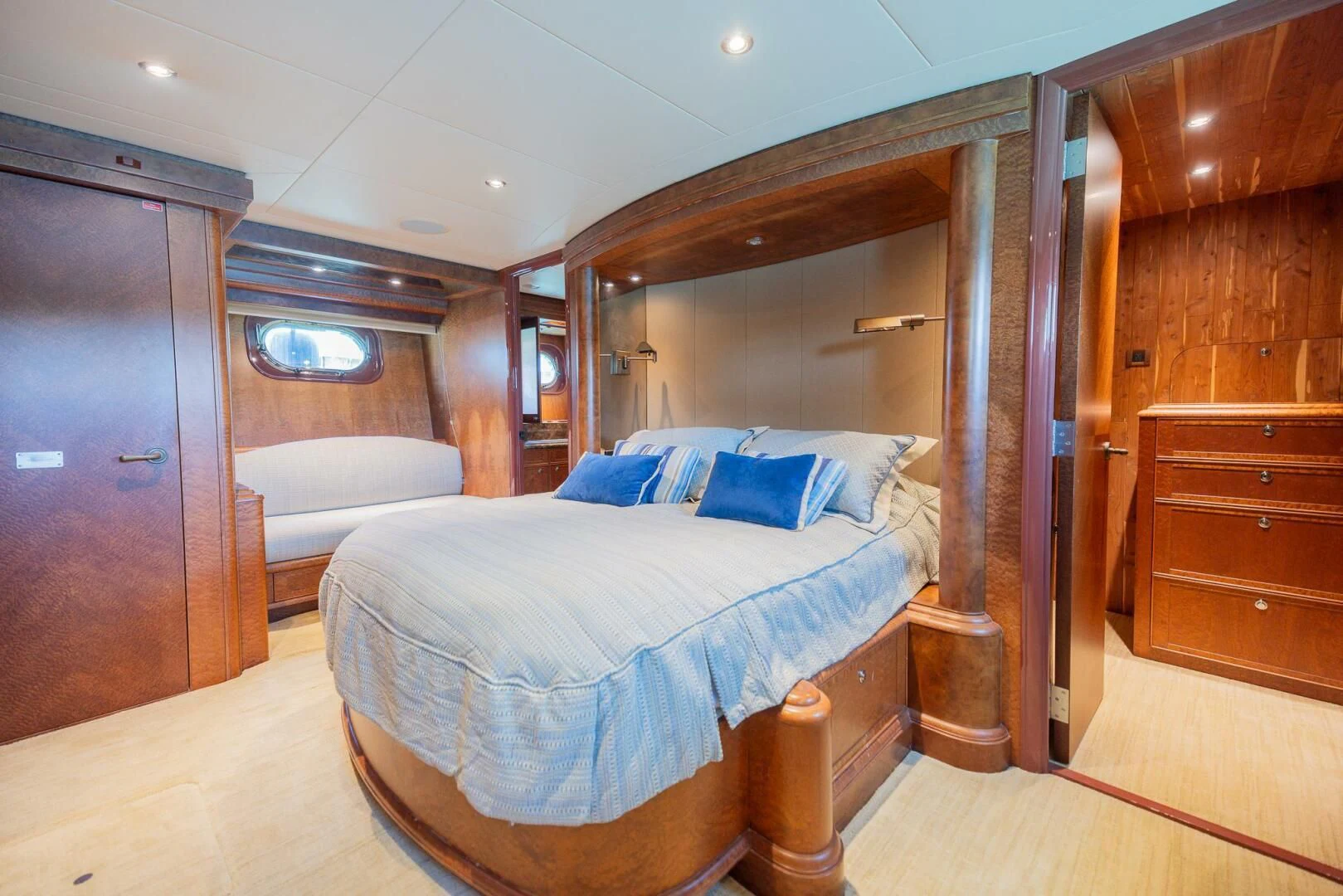 a room with a bed and a mirror aboard PREDATOR I Yacht for Sale