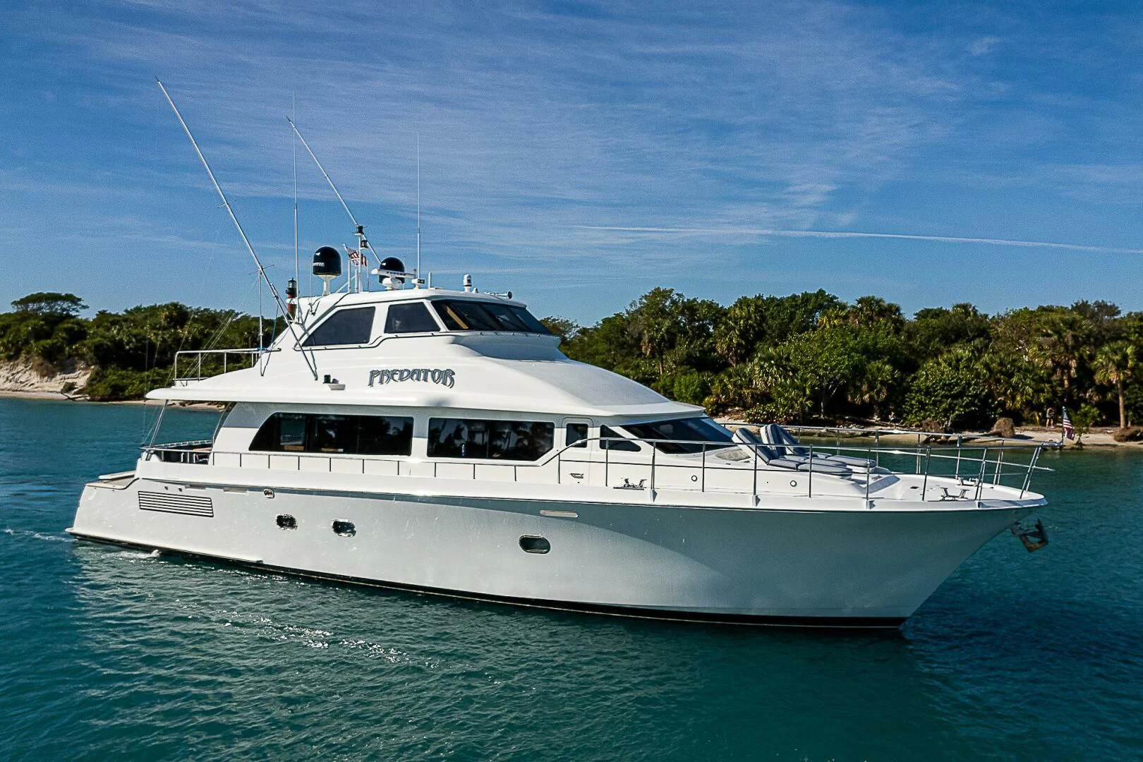 a white yacht in the water aboard PREDATOR I Yacht for Sale