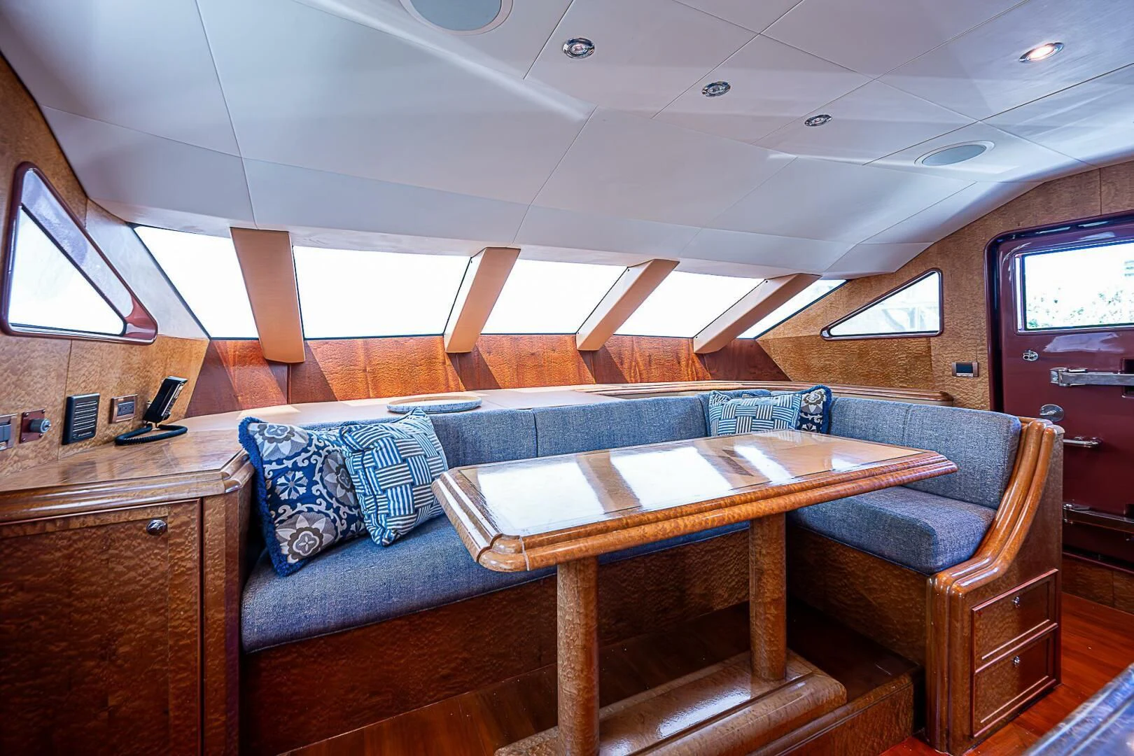 a living room with a couch and a table aboard PREDATOR I Yacht for Sale