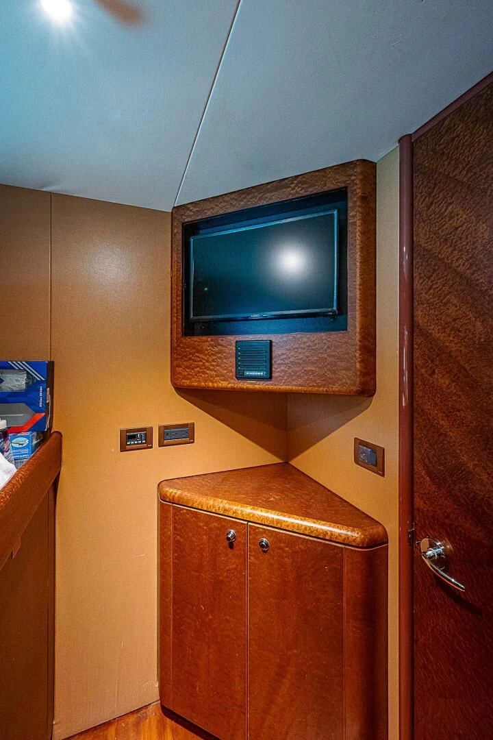 a tv on a wall aboard PREDATOR I Yacht for Sale