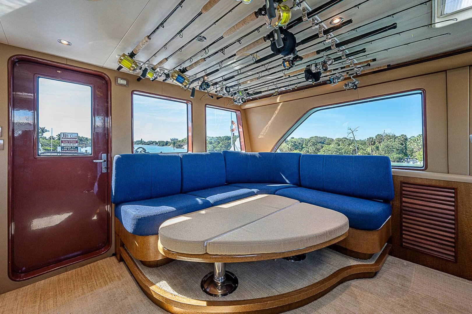 a blue couch in a boat aboard PREDATOR I Yacht for Sale