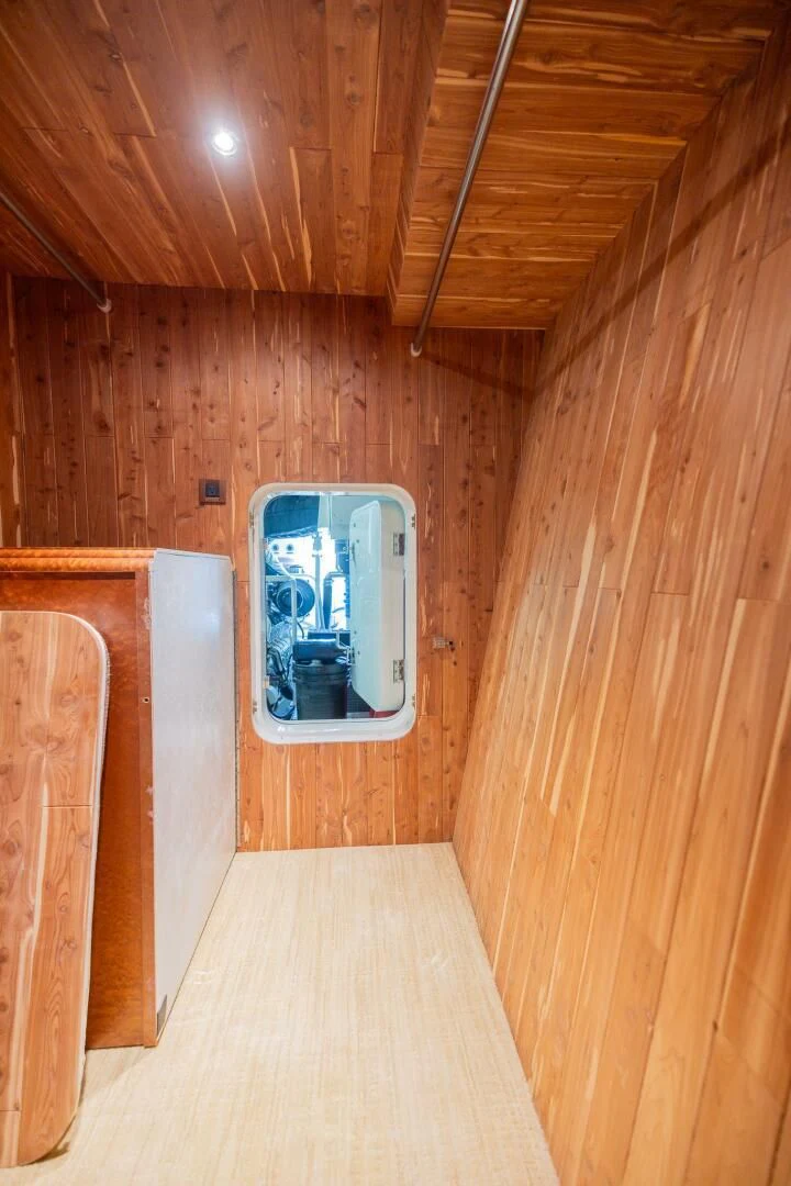 a small box in a wooden room aboard PREDATOR I Yacht for Sale